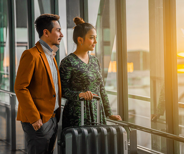 Couple looking out airport window